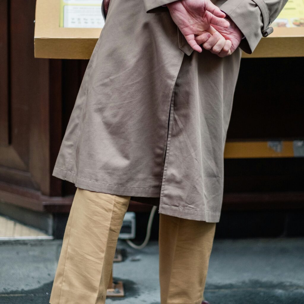 a person in a trench coat